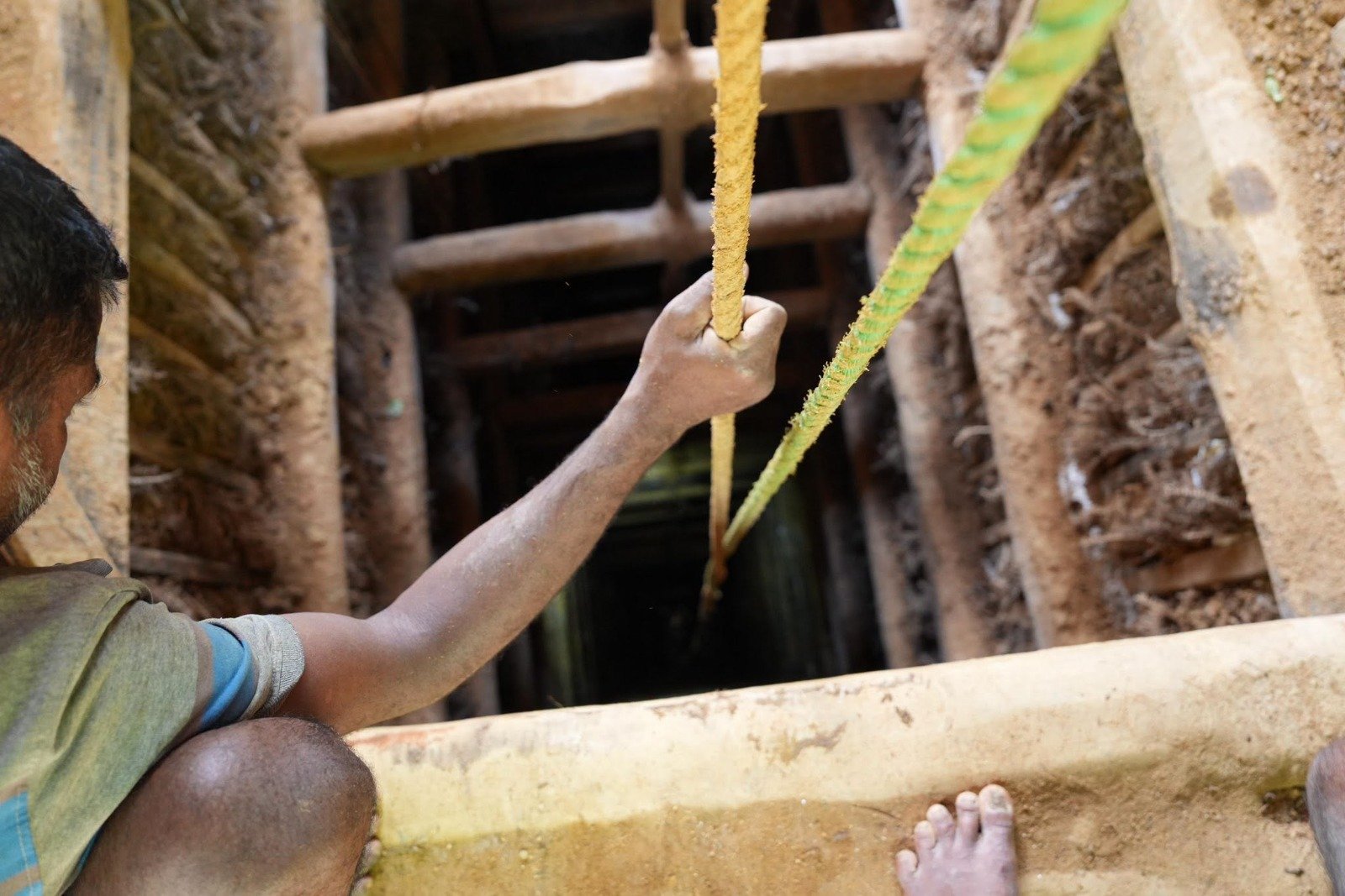Open pit gemstone mining excavation site in Sri Lanka
